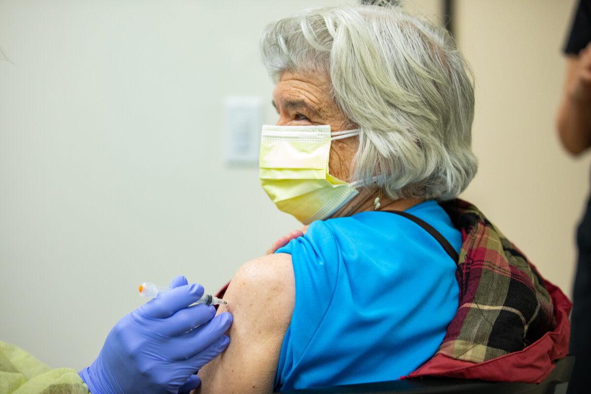 Constance Klein receives the Moderna vaccine at the Lestonnac Free Clinic in Orange, Calif., on March 9, 2021. (John Fredricks/The Epoch Times)
