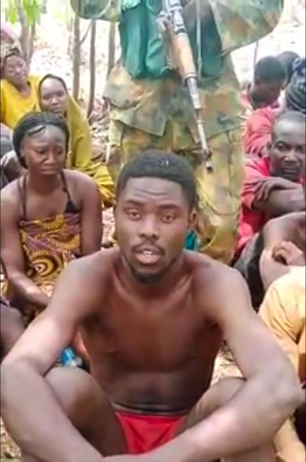 Students kidnapped from the Federal College of Forestry Mechanization, in an undisclosed location, held under armed guard, in a video released by the kidnappers on March 12, 2021. (screenshot)