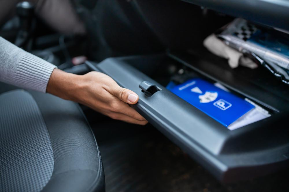Empty extra items from the glove box. (Andrey_Popov/Shutterstock)