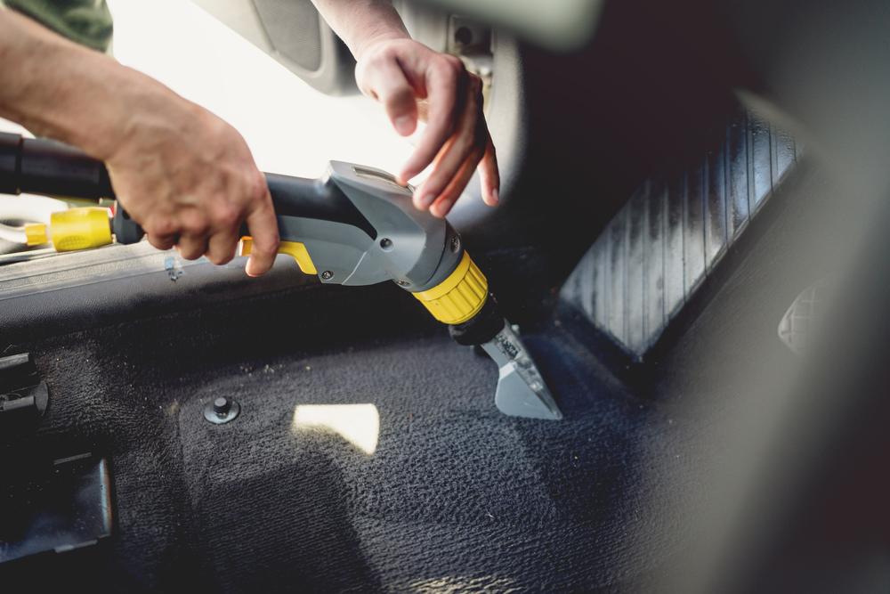 Vacuum the inside of the car, especially the carpet. (bogdanhoda/Shutterstock)