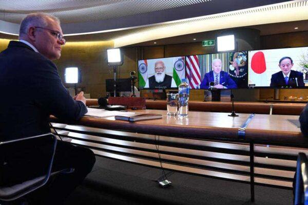 Australian Scott Morrison (L) participating in the inaugural Quad leaders meeting with the U.S. President Joe Biden, Japanese Prime Minister Yoshihide Suga and Indian Prime Minister Narendra Modi during a virtual meeting on Friday, March 12, 2021, in Sydney, Australia. (AAP Image/Pool/Dean Lewins)