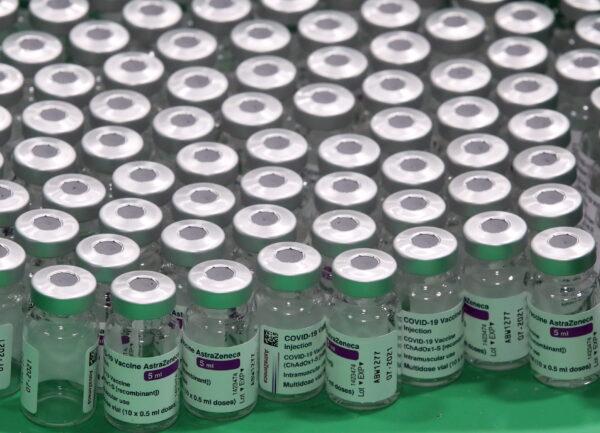 Empty vials of Oxford/AstraZeneca's COVID-19 vaccine are seen at a vaccination centre in Antwerp, Belgium, on March 18, 2021. (Yves Herman/Reuters)