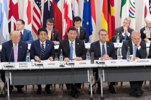 (From L to R) U.S. President Donald Trump, Japan's PM Shinzo Abe, Chinese leader Xi Jinping, WTO Director-General Roberto Azevedo, and Australia's PM Scott Morrison attend a meeting on the digital economy at the G20 Summit in Osaka on June 28, 2019. (Jacques Witt/AFP via Getty Images)