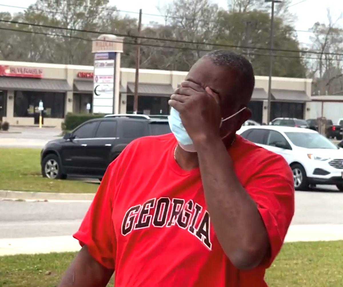 Citronelle High School custodian Samuel James in tears upon receiving the Toyota Highlander from his colleagues. (Courtesy of <a href="https://www.facebook.com/deborah.pippin">Deborah Pippin</a>)