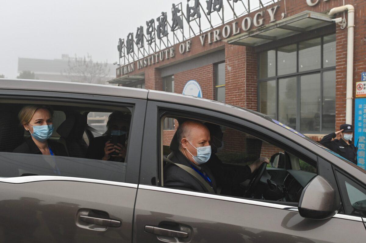 Peter Daszak (R) and other members of the World Health Organization team investigating the origins of the COVID-19 coronavirus, arrive at the Wuhan Institute of Virology on Feb. 3, 2021. (Hector Retamal/AFP via Getty Images)