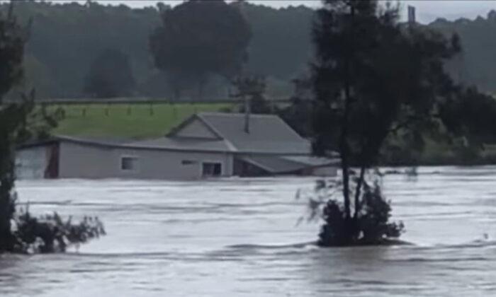 House Swept Down NSW River in Australia