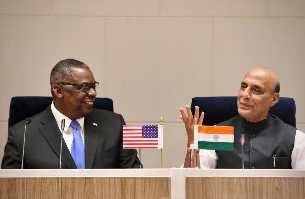 U.S. Defense Secretary Lloyd Austin (L) sits to deliver remarks with Indian Defense Minister Rajnath Singh (R) in New Delhi, India, on March 20, 2021. (Manish Swarup/AP Photo)
