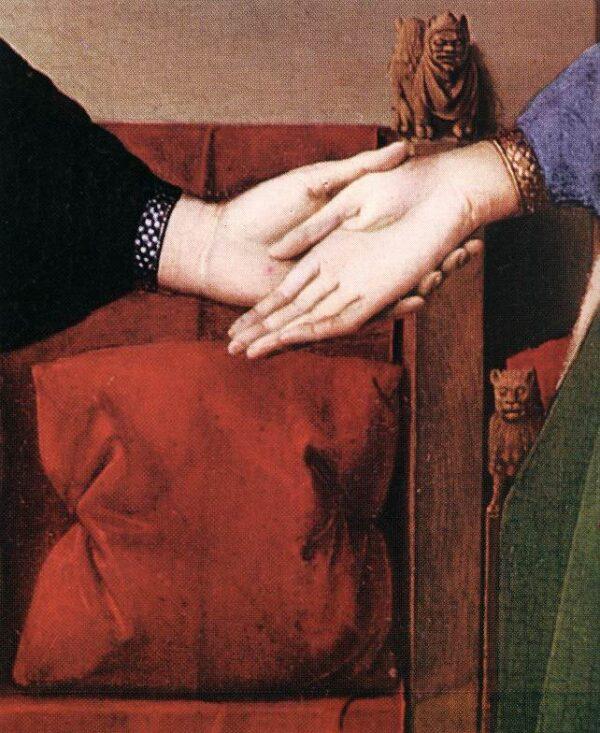 A gargoyle-like monster appears behind the couple's hands. A detail from “The Arnolfini Portrait,” 1434, by Jan van Eyck. National Gallery, London. (Public Domain)