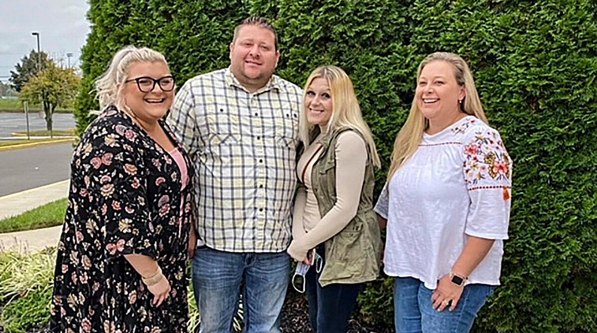 Jennifer Lannon, second from right, poses for a photo with her brother Chris Whitman, second from left, and sisters, Sarah Whitman, far left, and Kim Bermudez in Blackwood, N.J., in October 2020. (Sharon Whitman via AP)