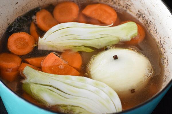 Simmer the veal with the broth and aromatics, then the additional vegetables. (Audrey Le Goff)