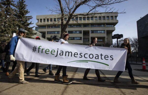 Supporters rally outside court as James Coates, pastor of Alberta's GraceLife Church, attended a bail hearing. Coates was jailed for holding church services as normal during COVID lockdowns. (Jason Franson/The Canadian Press)