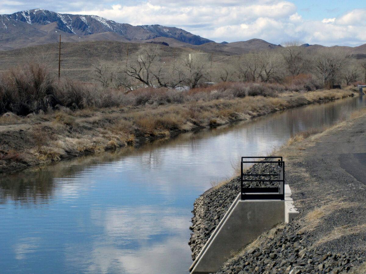 Water flows through an irrigation canal in Fernley, Nev. about 30 miles east of Reno, March 18, 2021. (Scott Sonner/AP Photo)