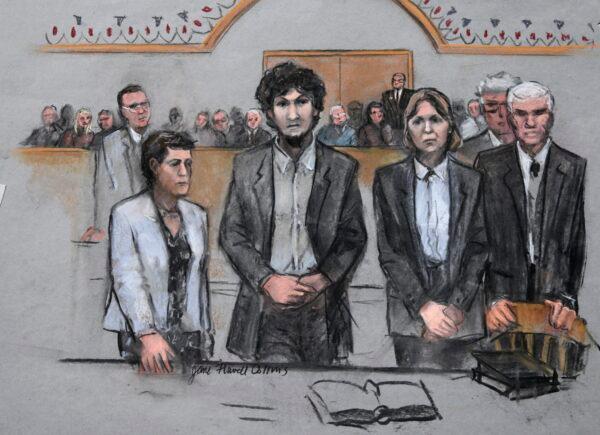In this courtroom sketch, Boston Marathon bomber Dzhokhar Tsarnaev (C) stands with his defense attorneys at the Moakley Federal court house in the penalty phase of his trial in Boston, on May 15, 2015. (Jane Flavell Collins via AP)