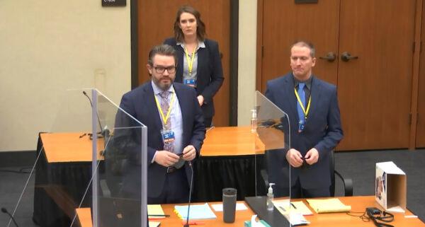 Defense attorney Eric Nelson (L) and defendant former Minneapolis police officer Derek Chauvin (R) and Nelson's assistant Amy Voss (B) introduce themselves to jurors at the Hennepin County Courthouse in Minneapolis, Minn., on March 22, 2021. (Court TV via AP/Pool)