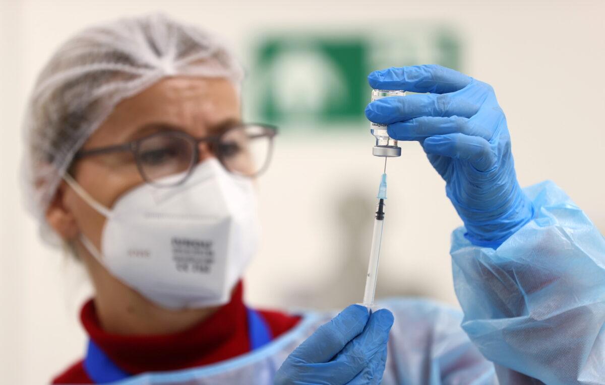 An AstraZeneca COVID-19 vaccine is prepared at the local vaccination center as the spread of the coronavirus disease (COVID-19) continues in Hagen, Germany, on March 19, 2021. (Kai Pfaffenbach/Reuters)