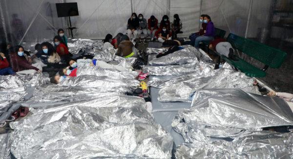  Family units and unaccompanied alien children are held in a temporary processing facility in Donna, Texas, after being apprehended by Border Patrol. (CBP)