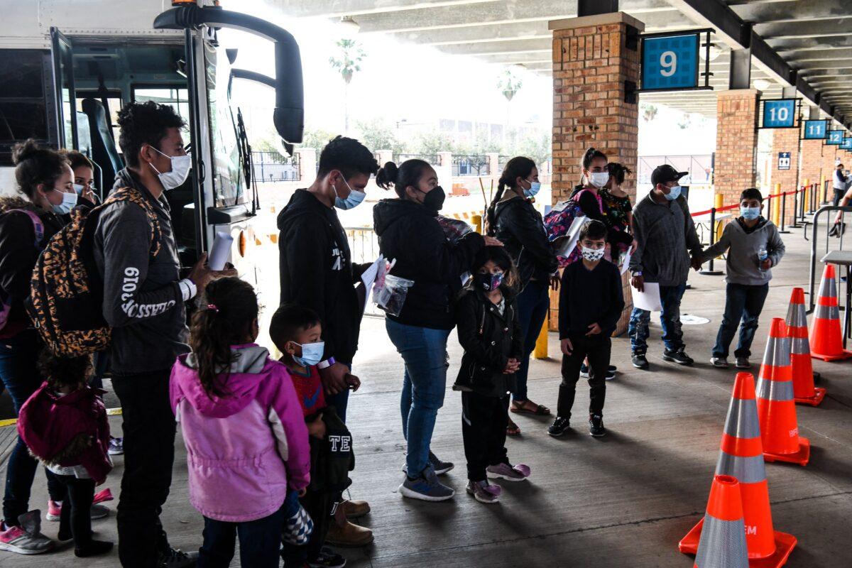  Illegal immigrants, mostly from Central America, are dropped off by Customs and Border Protection at a bus station in the border city of Brownsville, Texas, on March 15, 2021. (Chandan Khanna/AFP via Getty Images)