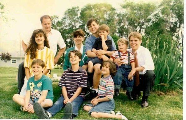 Growing up, the Harmons' parents, and grandparents, encouraged their entrepreneurial spirit. Jeffrey is in the bottom row, left, Daniel is in the bottom row, center. Neal is in the back row, center, in the blue shirt. (Courtesy of the Harmons)