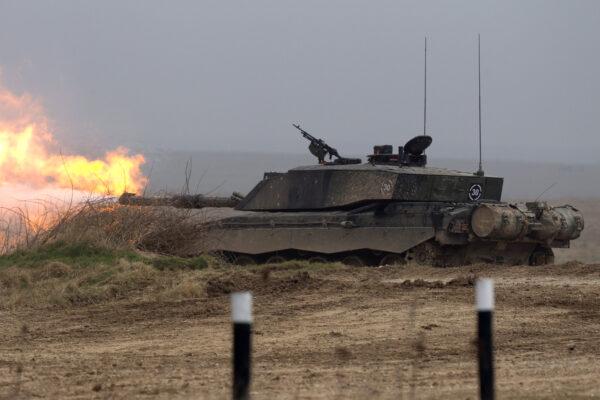 A Challenger 2 tank fires during Exercise Tractable, in Salisbury, England, on March 19, 2015. ( Matt Cardy/Getty Images)