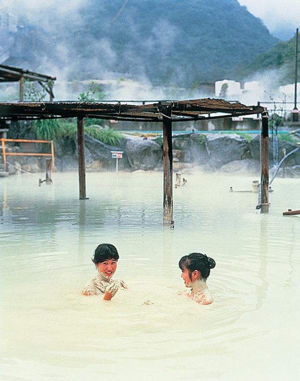 Spa-goers enjoy a hot spring, volcanic sand bath in the city of Beppu. (Courtesy of JNTO)