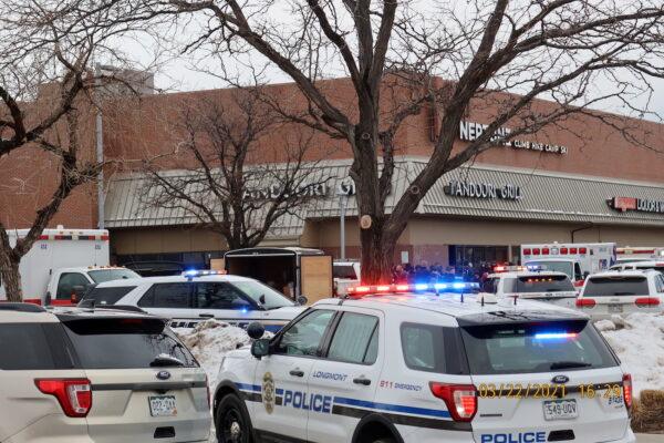 Police vehicles are seen at the scene where an active shooter was reported at a grocery store in Boulder, Colorado, on March 22, 2021. (Cecil Disharoon/via Reuters)