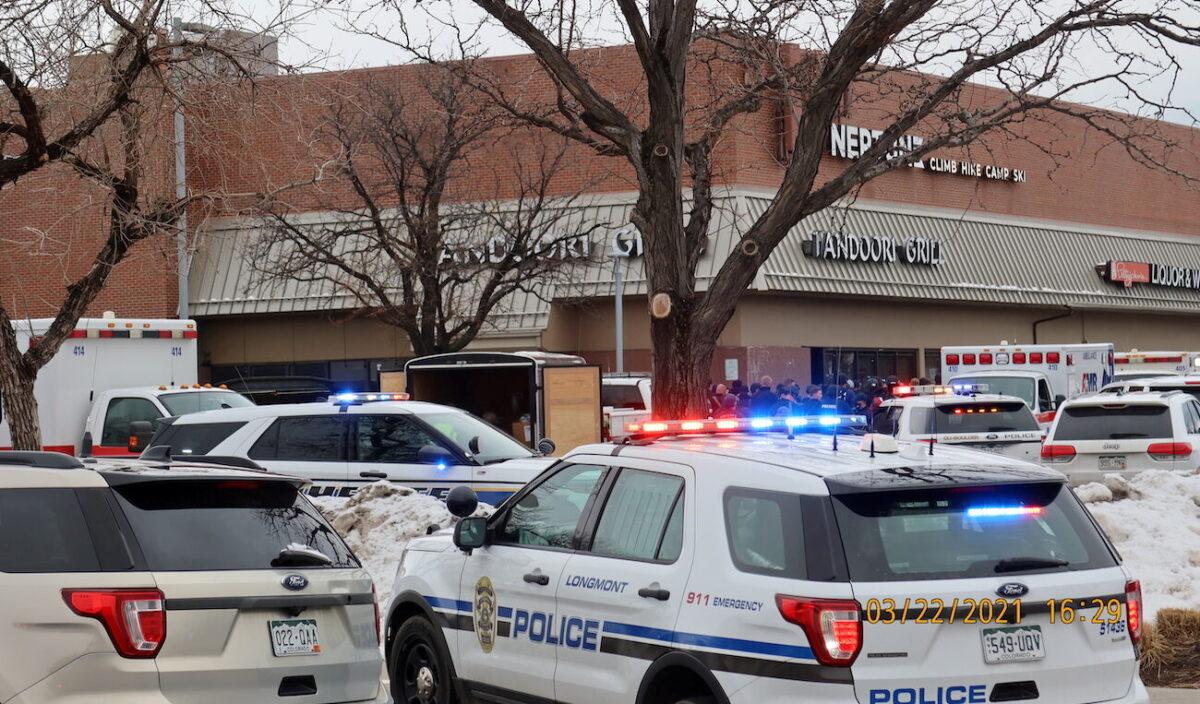Police vehicles are seen at the scene where an active shooter was reported at a grocery store in Boulder, Colo., on March 22, 2021. (Cecil Disharoon/via Reuters)