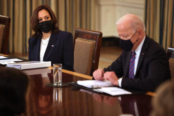 Vice President Kamala Harris (L) and President Joe Biden meet with cabinet members and immigration advisors in the State Dining Room in Washington on March 24, 2021. (Chip Somodevilla/Getty Images)