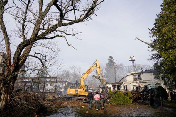 Firefighters work at the scene of a fire that burned down the Evergreen Court Home for Adults in Spring Valley, N.Y., on March 23, 2021. (Frank Franklin II/AP Photo)