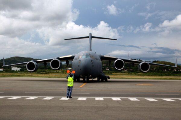 A Royal Australian Air Force (RAAF) Boeing C-17 transport aircraft, carrying some 8,000 initial doses of the AstraZeneca vaccine, taxis after landing at the Port Moresby international airport on March 23, 2021 (Andrew Kutan / AFP via Getty Images)