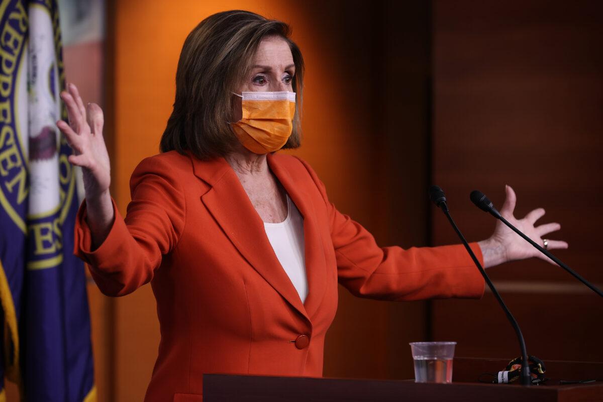 House Speaker Nancy Pelosi (D-Calif.) holds a news conference one day after Congress passed a $1.9 trillion COVID-related stimulus package at the Capitol Visitors Center in Washington on March 11, 2021. (Chip Somodevilla/Getty Images)