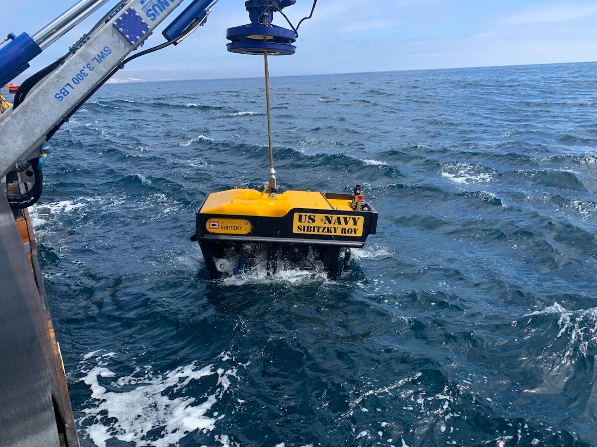 The Sibitzky Remotely Operated Vehicle is lowered in the recover the bodies of nine people killed when a Marine landing craft sank in hundreds of feet of water on July 30, 2020, off the Southern California coast, on Aug. 3, 2020. (Lt. Curtis Khol/U.S. Navy via AP)