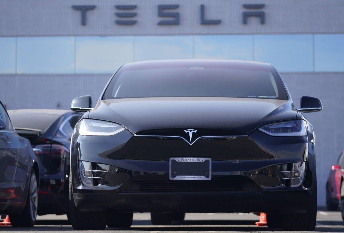 An unsold 2021 Model X sports-utility vehicle sits at a Tesla dealership, in Littleton, Colo., on Jan. 24, 2021. (David Zalubowski/AP Photo)