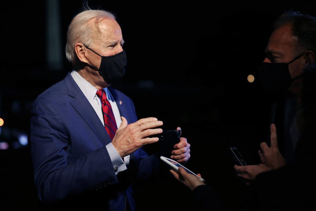 President Joe Biden talks briefly with reporters after arriving back at the White House in Washington on March 23, 2021. (Chip Somodevilla/Getty Images)
