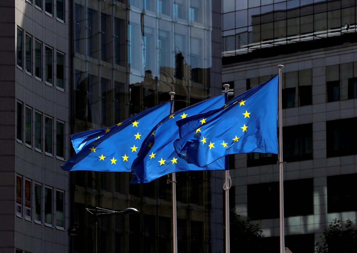 European Union flags flutter outside the European Commission headquarters in Brussels on Aug. 21, 2020. (Yves Herman/Reuters)
