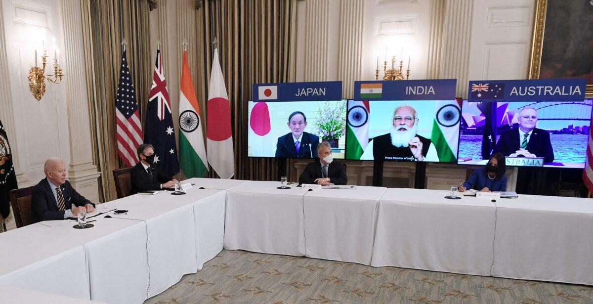 President Joe Biden (L), with Secretary of State Antony Blinken (2nd L), meets virtually with members of the "Quad" alliance of Australia, India, Japan, and the United States, in the State Dining Room of the White House in Washington on March 12, 2021. (Olivier Douliery/AFP via Getty Images)
