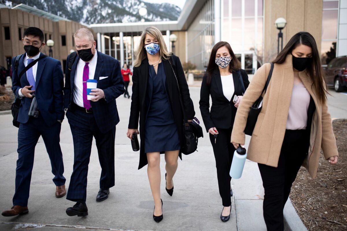 The defense legal team led by public defenders Kathryn Herold (C) and Daniel King (2nd L) leave Boulder county court after the initial appearance of King Soopers shooting suspect Ahmad Al Aliwi Alissa, in Boulder, Colo., on March 25, 2021. (Alyson McClaran/Reuters)