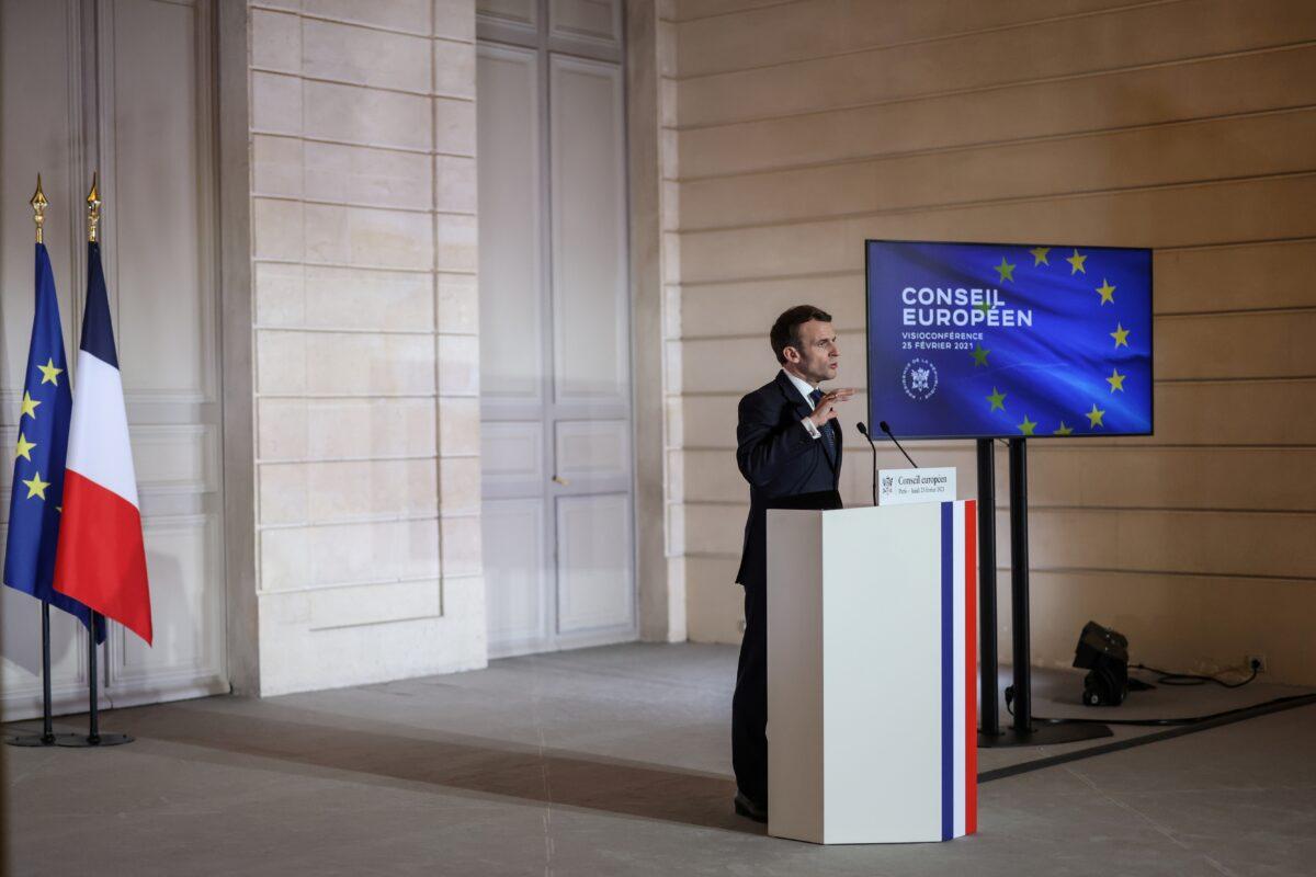 French President Emmanuel Macron delivers a press conference after a European Council summit held over video-conference, in Paris, France, on Feb. 25, 2021. (Thomas Coex/Pool via Reuters)
