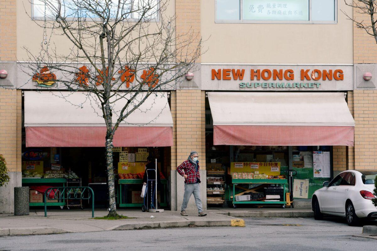 A man walks past New Hong Kong Supermarket in Richmond, British Columbia, on Jan. 26, 2021. (Reuters/Jennifer Gauthier)