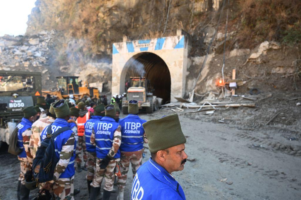Indo-Tibetan Border Police (ITBP) personnel stand outside the entrance of the Tapovan tunnel during rescue efforts in the Chamoli district of Uttarakhand state of India on Feb. 11, 2021, where dozens were still feared to be trapped following a flash flood thought to have been caused when a glacier broke off on Feb. 7. (SAJJAD HUSSAIN/AFP via Getty Images)