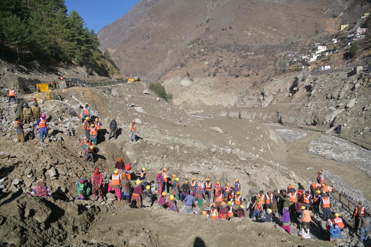 Border Roads Organization (BRO) workers rebuild the destroyed Raini bridge in Chamoli district on Feb. 13, 2021, after the Raini bridge was washed away by a flash flood thought to have been caused when a glacier burst on Feb. 7. (Virender Singh Negi/AFP via Getty Images)