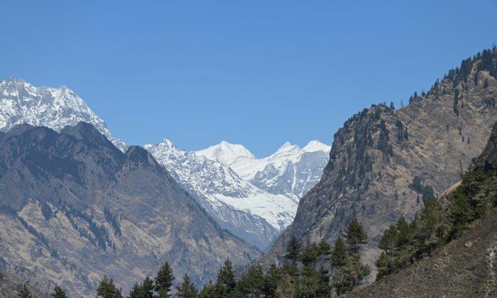 Similar Catastrophes in Himalayas Viewed Differently in China, India