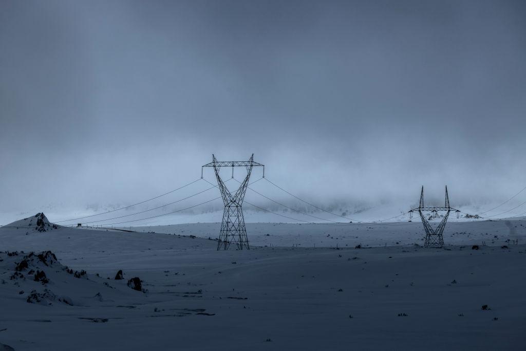 Power lines connected to the Snowy hydro-electric scheme are seen running through Kosciuszko National Park as record snowfall impacts the region on August 23, 2020 in Kosciuszko National Park, Australia. (Brook Mitchell/Getty Images)