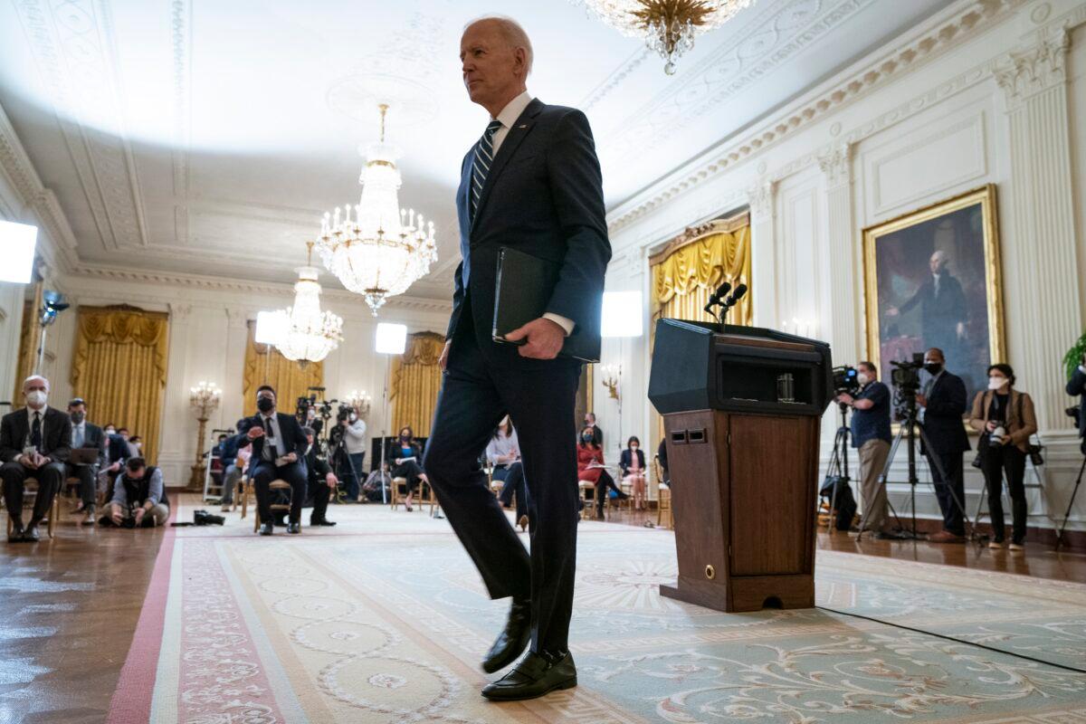 President Joe Biden walks off, holding his notes, after a news conference in the East Room of the White House in Washington on, March 25, 2021. (Evan Vucci/AP Photo)