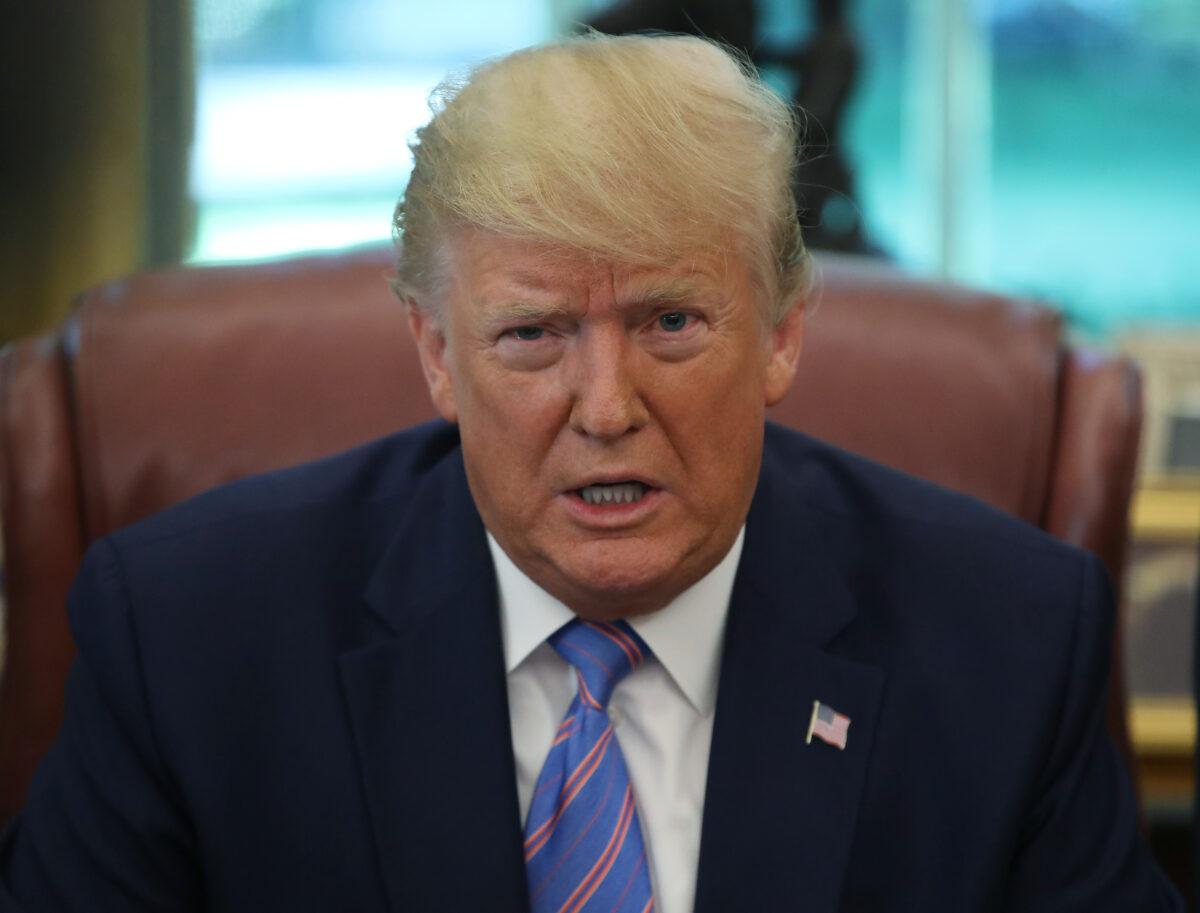 Then-President Donald Trump speaks to the media after signing a bill for border funding in the Oval Office at the White House in Washington on July 1, 2019. (Mark Wilson/Getty Images)