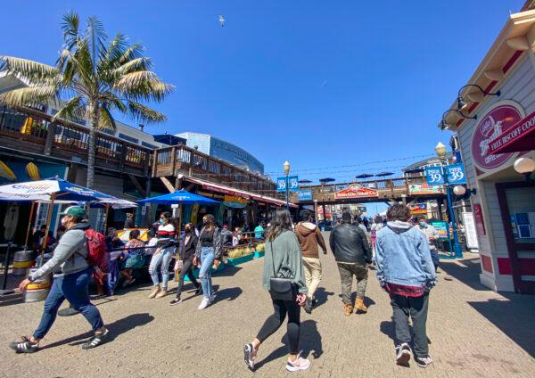 Pier 39 in San Francisco is seeing more tourists on March 25, 2021, as the city eases pandemic restrictions into the Orange Tier. (Ilene Eng/The Epoch Times)