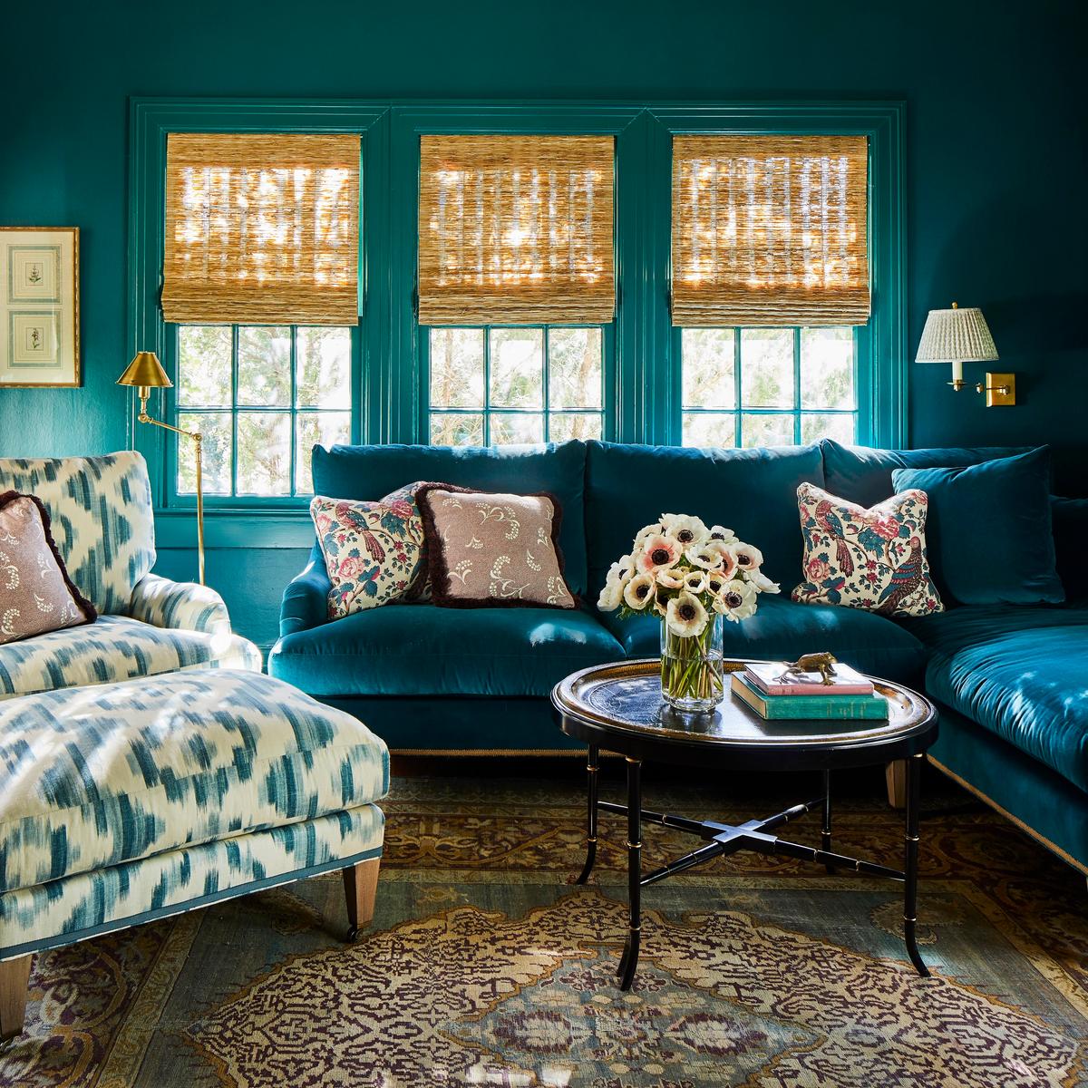 Where does an entertaining maven go to get away from it all? Her private den, painted deep teal at her request, with a matching velvet sectional and all the trimmings. (Laurey Glenn)