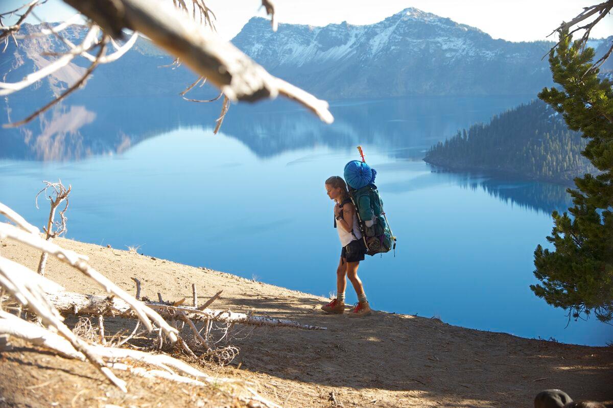 Cheryl Strayed (Reese Witherspoon) hiking near a lake, in “Wild.” (Fox Searchlight Pictures)