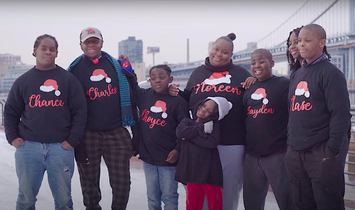 Noreen Owens (C) with her seven children: (L to R) Chance, 14, Charles, 18, Choyce, 9, Chaylese, 6, Chayden, 10, Charish, 17, and Chase, 11. (Courtesy of <a href="https://allthatsgood.tv/">All That’s Good</a> via <a href="https://www.youtube.com/watch?v=KqxLQ023HX4">The Harbaughs</a>)