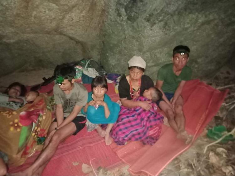 Ethnic Karen villagers displaced from Myanmar's Day Pu Noh village are seen in an unknown location in Karen state, after fleeing Burmese army air strikes, in this picture obtained from social media, Burma, on March 27, 2021. (Free Burma Rangers/via Reuters)