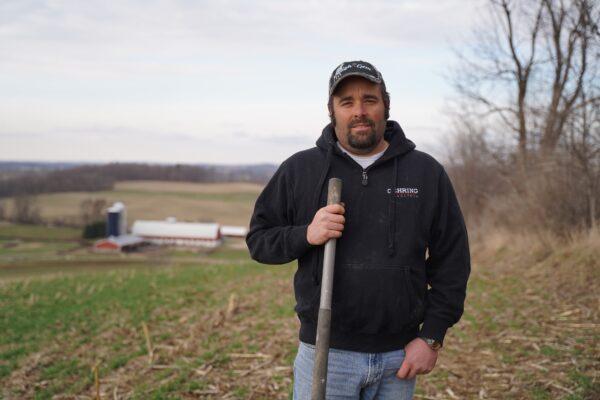 Chris Conley, a member of Dodge County Farmers for Healthy Soil and Healthy Water, stands on his dairy farm in Neosho, Wis., on March 26, 2021. (Cara Ding /The Epoch Times)